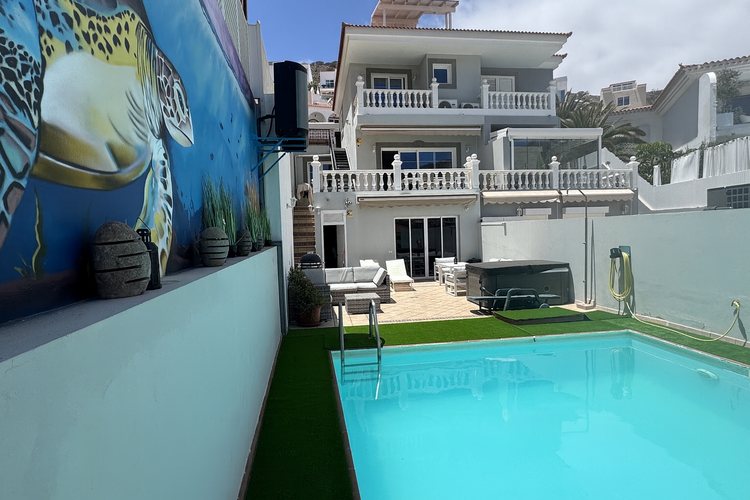 Mediterranean villa with crystal turquoise pool and stunning marine mural artwork