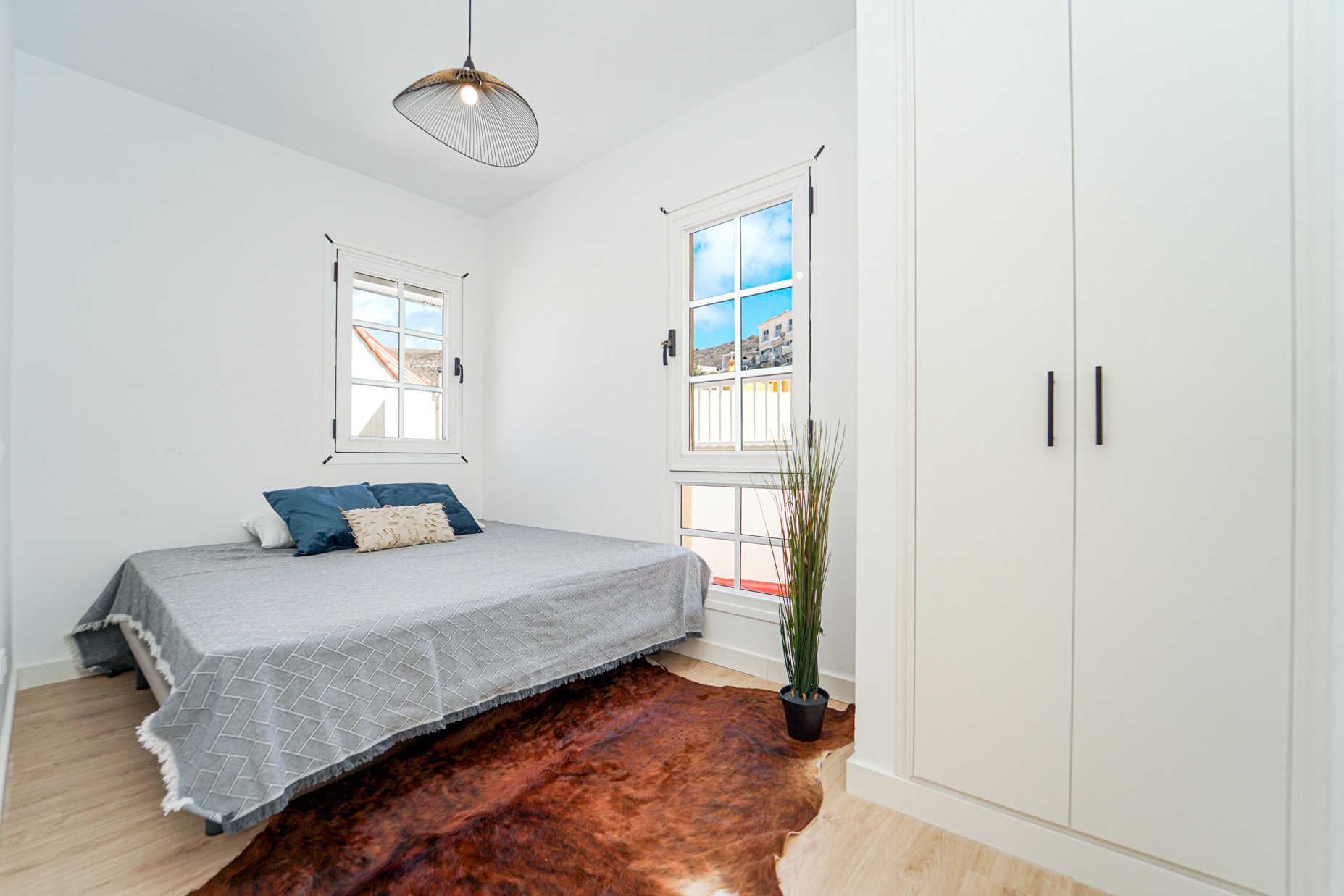 Modern coastal bedroom with ocean views and contemporary design