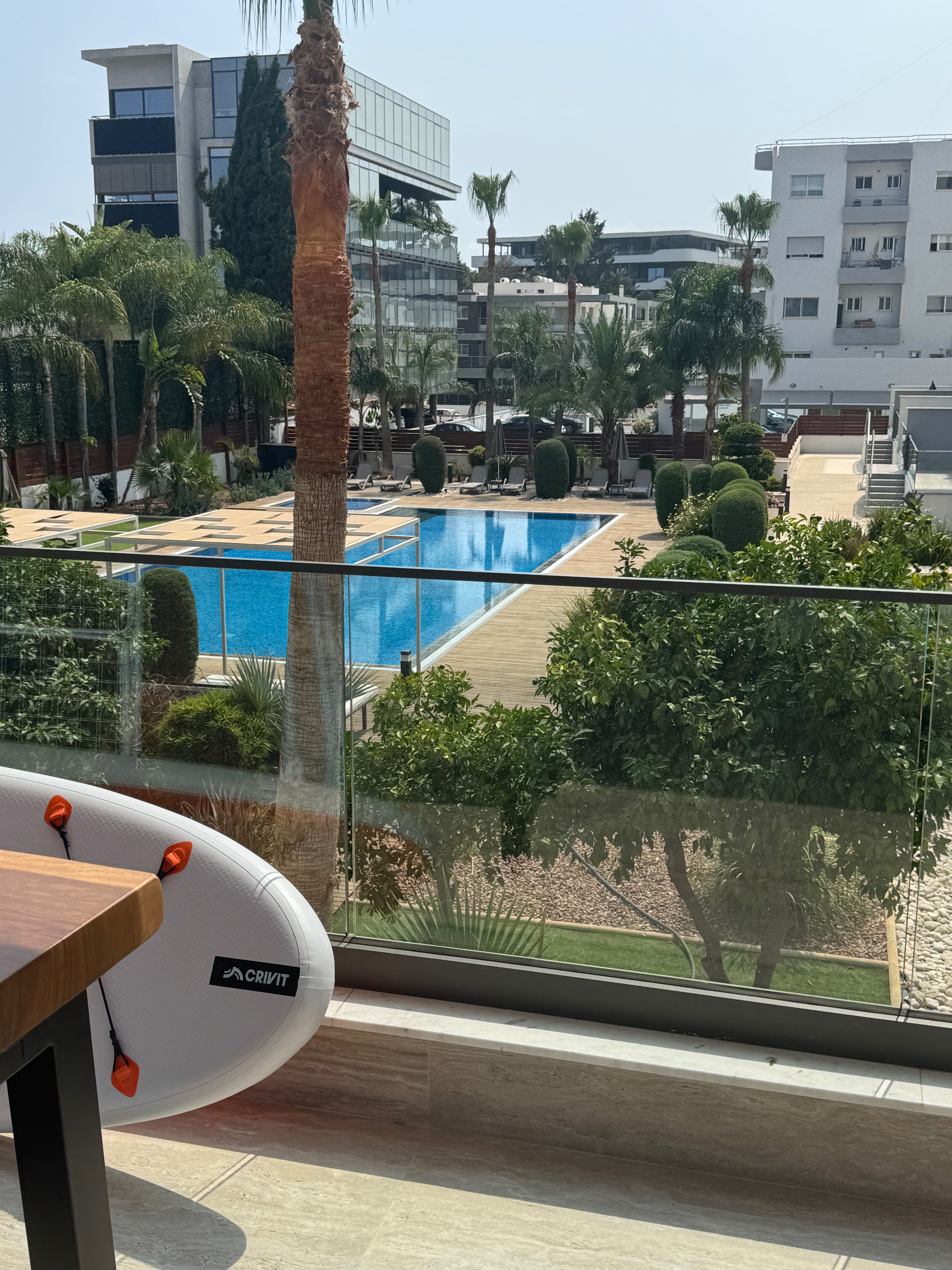 Limassol luxury apartment with Mediterranean pool views and palm trees
